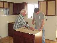 Gene and I installing kitchen 4 10 04